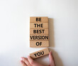 Be the best version of you symbol. Concept words Be the best version of you on wooden blocks. Businessman hand. Beautiful white background. Business concept. Copy space.