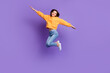 © deagreez - Full length size photo of charming nice woman flying like bird carefree relax vacation trip weekend chill isolated on bright violet color background