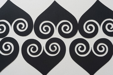 Canvas Print - spade and heart glyph cutouts with fancy swirl pattern on blank paper