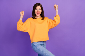 Sticker - Portrait photo of youngster pretty lady wear yellow sweater toothy open mouth fists up celebrate winner winter season sale isolated on purple color background