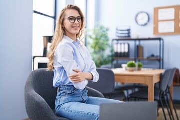 Poster - Young blonde woman business worker smiling confident with arms crossed gesture at office