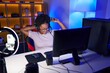 © Krakenimages.com - African american woman streamer playing video game with winner expression at gaming room