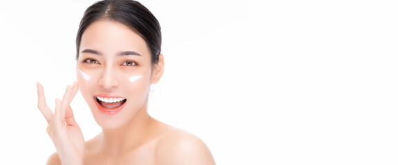 Close up Beauty portrait beautiful Asian young woman laughing applying face cream and looking camera with smile face isolated on white background Beautiful girl touching beauty facial skin on cheek