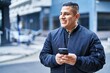 © Krakenimages.com - Young latin man smiling confident using smartphone at street