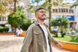 © Krakenimages.com - Young hispanic man smiling confident standing at park