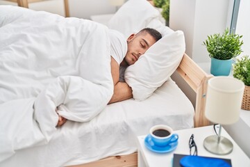 Wall Mural - Young hispanic man lying on bed sleeping at bedroom