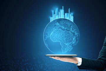 Poster - Close up of man hand holding tablet with glowing map with city hologram on blurry background. Abstract metaverse virtual reality concept building and digital map.