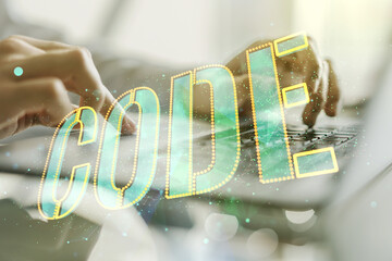 Poster - Creative Code word hologram and hands typing on computer keyboard on background, artificial intelligence and neural networks concept. Multiexposure