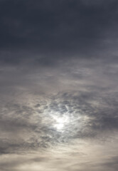 Wall Mural - photo of overcast sky with sun through stormy clouds..