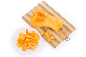 Wall Mural - Slices, half of butternut squash on dish and cutting board