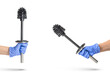 Toilet brush in hand on a white isolated background, a hand in a blue rubber glove holds a black chrome toilet brush
