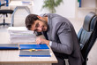 © Elnur - Young male employee and too much work in the office