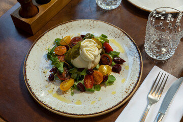 Tomatoes with mozzarella and basil sauce