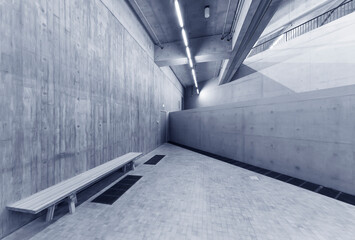 Poster - Empty wooden bench in modern architecture. Interior background