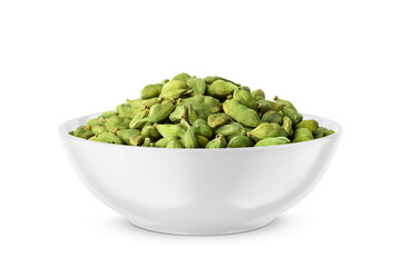 Cardamom pods in white bowl isolated on white. Side view.