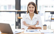 © David - Asian Businesswoman Using laptop computer and working at office with calculator document on desk, doing planning analyzing the financial report, business plan investment, finance analysis concept.