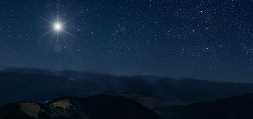 the star shines over the manger of christmas of jesus christ.