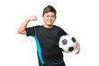 © luismolinero - Little caucasian football player kid over isolated chroma key background doing strong gesture