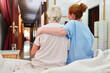© Robert Kneschke - Caring nurse hugging sick old woman
