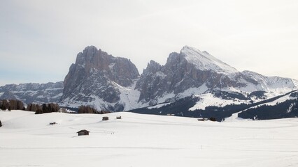 Wall Mural - Aerial view of buildings in snow covered mountain landscape in Dolomites