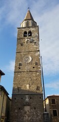 Wall Mural - Low angle view of church building tower in Buje