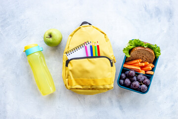 Wall Mural - School lunch box with sandwich, fruits and water