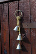 Bells hung on wooden walls.