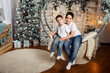 © elenbessonova - Two adorable boys are opening presents on Christmas. New years eve. Happy brothers on holidays. Christmas evening at family house. Cozy holiday at home. love, happiness and big family concept