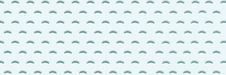 Wall Mural - Pave eyelashes on blue background. Female cosmetics. Extension and lengthening of eyelashes. Banner. Pattern.