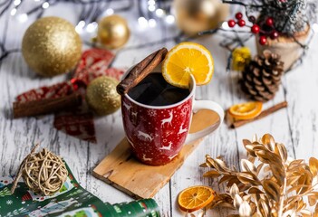 Sticker - Tasty Christmas mulled wine in a festive cup served with cinnamon sticks and a slice of lemon