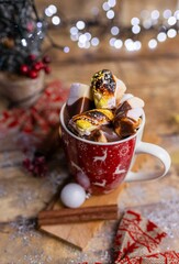 Sticker - Vertical shot of tasty hot chocolate with marshmallows in a red Christmas cup