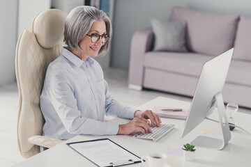 Wall Mural - Profile portrait of clever experienced lawyer lady sit chair keyboard write email communicate colleagues modern office indoors