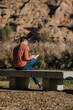 © ADDICTIVE STOCK - Anonymous man reading book in park