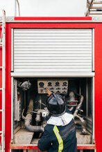 Anonymous Fireman Reading Fire Engine Data