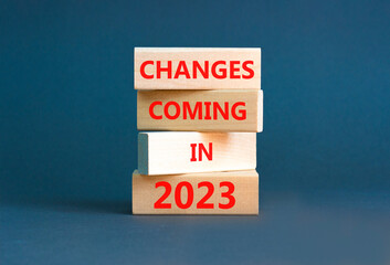 Wall Mural - Changes coming in 2023 symbol. Concept word Changes coming in 2023 on wooden blocks. Beautiful grey table grey background. Business and changes coming in 2023 concept. Copy space.