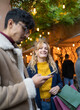 © victor cuenca lopez - selective focus on smiling Blonde woman looking at after shopping with her boyfriend