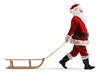 Full length profile shot of santa claus pulling a wooden sleigh
