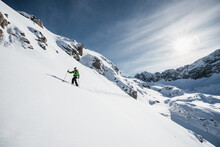 Man ski touring in Austrian Alps, Arlberg, Vorarlberg, Austria