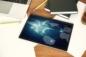 Poster - Top view of modern digital tablet monitor with abstract world map with connections, research and strategy concept. 3D Rendering