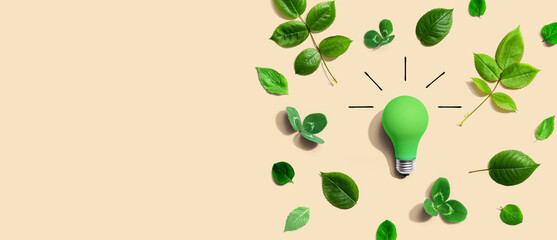Poster - Green light bulb with green leaves - Flat lay