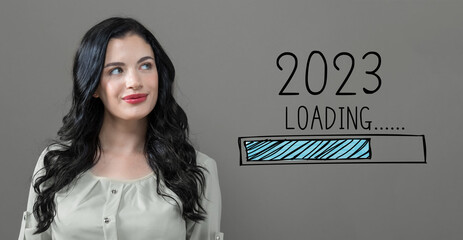 Poster - Loading new year 2023 with young woman in a thoughtful face