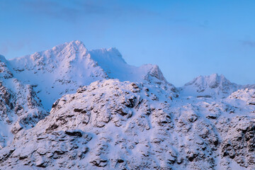 Wall Mural - north. winter landscape during sunset. bright sky. mountain peaks during sunset. snowy winter. natur