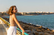 © Enigma - Portrait of a young stylish woman on the city embankment