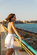 © Enigma - Portrait of a young stylish woman on the city embankment