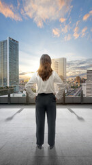 Wall Mural - Rear view of Asian businesswoman standing