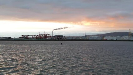 Wall Mural - Aerial view of port surrounded buildings in Dublin during sunset