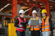 © eakgrungenerd - Three man industrial engineers wear hard hats and uniform using laptop talking project of factory inside heavy industry manufacturing. Supervisor teaching work to employee.