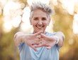 © Anela/peopleimages.com - Portrait, senior woman and stretching hands, outdoor and exercise for retirement, health and fitness. Elderly female, mature lady and workout for training, healthy lifestyle and smile for wellness.