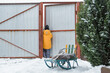 © shintartanya - Winter games. Family playing snowballs in the courtyard of the house. winter, game, snow, christmas games, snow games, snowball fights, activity in winter,cottagecore,countryside