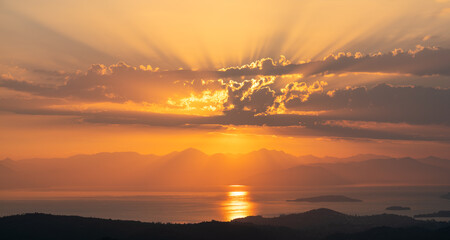 Wall Mural - beautiful sunrise over the mountains and the sea